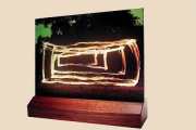 Ikon: "Lichtschleuder Motive als Glasskulptur im Holzsockel"